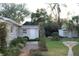 Landscaped backyard with brick patio and garden at 620 E Park St, Lakeland, FL 33803