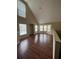 Spacious living room with hardwood floors and large windows at 6348 Raleigh St # 1311, Orlando, FL 32835