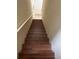 Indoor view of wooden staircase leading upstairs at 6348 Raleigh St # 1311, Orlando, FL 32835