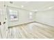 Bright and airy bedroom with two windows and vinyl flooring at 6668 Pompeii Rd, Orlando, FL 32822