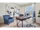 Bright home office featuring a desk, chair, and artwork at 7110 Painted Bunting Way, Saint Cloud, FL 34773