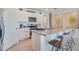 Island kitchen with white cabinets and granite countertops at 7116 Painted Bunting Way, Saint Cloud, FL 34773