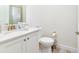 Small bathroom with toilet and vanity at 8019 Knee Deep Rd, Kissimmee, FL 34747