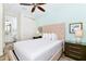 Bedroom with king bed, en-suite bathroom, and balcony view at 8019 Knee Deep Rd, Kissimmee, FL 34747