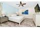 King bedroom with water view art and ceiling fan at 8019 Knee Deep Rd, Kissimmee, FL 34747