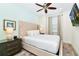 Bedroom with a king-size bed and mounted TV at 8019 Knee Deep Rd, Kissimmee, FL 34747