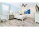 King bedroom with water view art and ceiling fan at 8019 Knee Deep Rd, Kissimmee, FL 34747