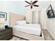 Bedroom with a king-size bed and mounted TV at 8019 Knee Deep Rd, Kissimmee, FL 34747