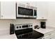 Stainless steel cooktop with built in microwave at 8019 Knee Deep Rd, Kissimmee, FL 34747
