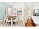 Bright dining area with a farmhouse table and chairs at 8019 Knee Deep Rd, Kissimmee, FL 34747