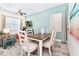 Bright dining area with a farmhouse table and chairs at 8019 Knee Deep Rd, Kissimmee, FL 34747