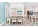 Bright dining area with a farmhouse table and chairs at 8019 Knee Deep Rd, Kissimmee, FL 34747