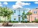 Two-story light blue house with a landscaped yard at 8019 Knee Deep Rd, Kissimmee, FL 34747