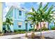 Two-story light blue house with landscaping at 8019 Knee Deep Rd, Kissimmee, FL 34747