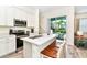 Kitchen with stainless steel appliances and breakfast bar at 8019 Knee Deep Rd, Kissimmee, FL 34747