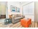Cozy living room with a sofa, TV, and accent pieces at 8019 Knee Deep Rd, Kissimmee, FL 34747
