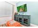 Cozy living room with a sofa, TV, and accent pieces at 8019 Knee Deep Rd, Kissimmee, FL 34747