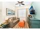 Cozy living room with a sofa, TV, and accent pieces at 8019 Knee Deep Rd, Kissimmee, FL 34747
