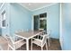 Covered patio with table and chairs for dining at 8019 Knee Deep Rd, Kissimmee, FL 34747