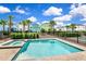 Community pool and spa with surrounding landscaping at 8019 Knee Deep Rd, Kissimmee, FL 34747