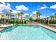 Community pool with surrounding homes at 8019 Knee Deep Rd, Kissimmee, FL 34747