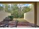 Private backyard with patio furniture and wooded view at 8145 Roseville Blvd, Davenport, FL 33896
