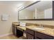 Double vanity bathroom with granite countertop at 8145 Roseville Blvd, Davenport, FL 33896