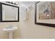 Small bathroom with pedestal sink and framed art at 8145 Roseville Blvd, Davenport, FL 33896