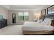 Spacious Primary bedroom with king-size bed and large window at 8145 Roseville Blvd, Davenport, FL 33896