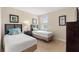 Twin bedroom with two beds and dresser at 8145 Roseville Blvd, Davenport, FL 33896