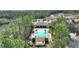 Aerial view of community pool with surrounding lounge chairs and landscaping at 8145 Roseville Blvd, Davenport, FL 33896