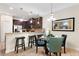 Kitchen and dining area with seating for four at 8145 Roseville Blvd, Davenport, FL 33896
