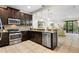 Modern kitchen with stainless steel appliances and granite countertops at 8145 Roseville Blvd, Davenport, FL 33896