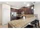 Modern kitchen with stainless steel appliances and granite countertops at 8145 Roseville Blvd, Davenport, FL 33896