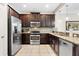 Modern kitchen with stainless steel appliances and granite countertops at 8145 Roseville Blvd, Davenport, FL 33896