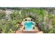 Community pool with lounge chairs and a gazebo at 8145 Roseville Blvd, Davenport, FL 33896