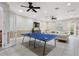 Community recreation room with ping pong table and seating at 8145 Roseville Blvd, Davenport, FL 33896
