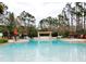 Inviting resort-style pool with a pergola and comfortable seating at 8145 Roseville Blvd, Davenport, FL 33896