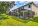Home with fenced-in pool and screened patio area at 8848 Candy Palm Rd, Kissimmee, FL 34747