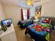 Marvel-themed bedroom with twin beds, TV, and ample closet space at 8848 Candy Palm Rd, Kissimmee, FL 34747