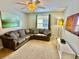 Comfortable Gathering room with sectional sofa and TV at 8848 Candy Palm Rd, Kissimmee, FL 34747