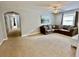 Spacious living area with L-shaped sectional sofa and neutral decor at 8848 Candy Palm Rd, Kissimmee, FL 34747