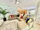 Spacious living room with sectional sofa and large TV at 8848 Candy Palm Rd, Kissimmee, FL 34747