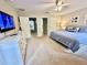 Main bedroom with king-size bed and en-suite bathroom at 8848 Candy Palm Rd, Kissimmee, FL 34747