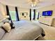 Main bedroom with king-size bed and ample closet space at 8848 Candy Palm Rd, Kissimmee, FL 34747