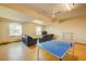 Finished basement with ping pong table and seating area at 133 Summer Place Loop, Clermont, FL 34714