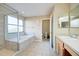 Relaxing bathroom with soaking tub and separate shower at 133 Summer Place Loop, Clermont, FL 34714