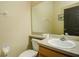 Simple bathroom with a toilet and sink at 133 Summer Place Loop, Clermont, FL 34714