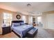 Large main bedroom with king-size bed, sitting area, and lots of natural light at 133 Summer Place Loop, Clermont, FL 34714