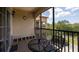 Screened balcony with table and chairs at 1351 Tuscan Ter # 8401, Davenport, FL 33896